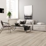 Arctic grey oak effect LVT flooring laid in a living room