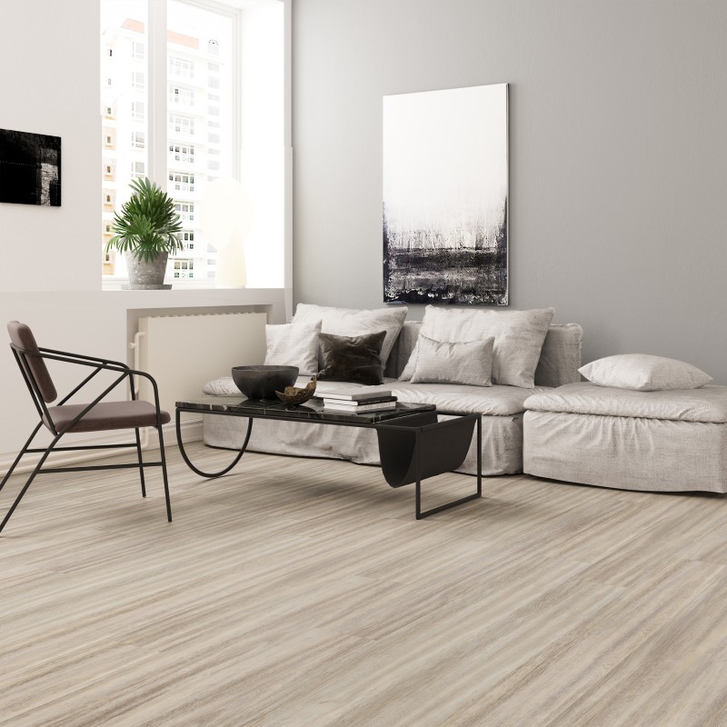 Arctic grey oak effect LVT flooring laid in a living room