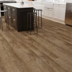 Distressed oak effect LVT flooring laid in a kitchen