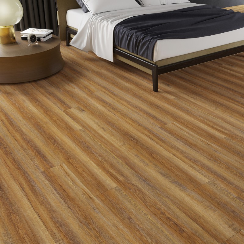 Royal oak effect LVT flooring laid in a bedroom