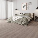 Silver oak effect LVT flooring laid in a bedroom