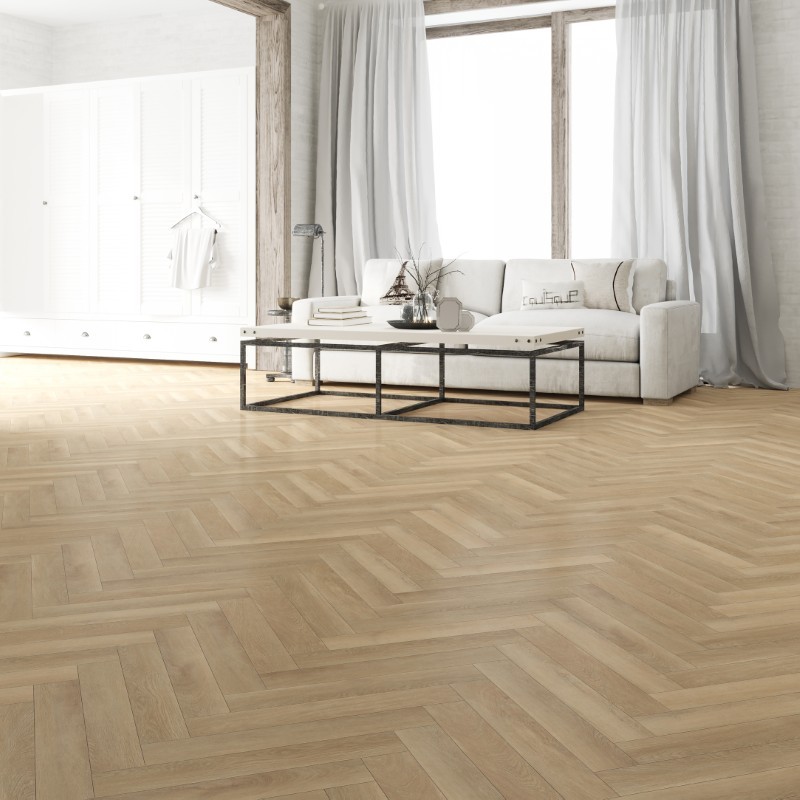 Blonde oak effect herringbone LVT flooring laid in a living room