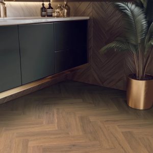 California oak effect herringbone LVT flooring laid in bathroom