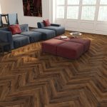 Chicory haze effect herringbone LVT flooring laid in a living room