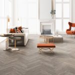 County oak effect herringbone LVT flooring laid in a living room