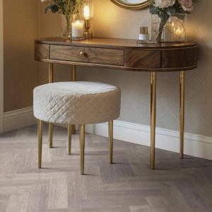 County oak effect herringbone LVT flooring laid in a bedroom