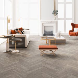 County oak effect herringbone LVT flooring laid in a living room