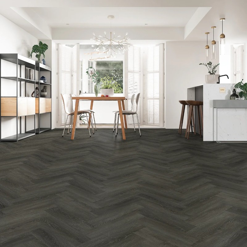 Ebony oak effect herringbone LVT flooring laid in a living room