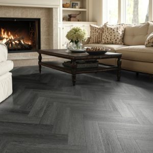 Ebony oak effect herringbone LVT flooring laid in a living room