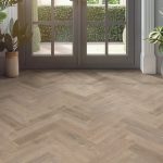 european oak effect herringbone LVT flooring laid in a living room