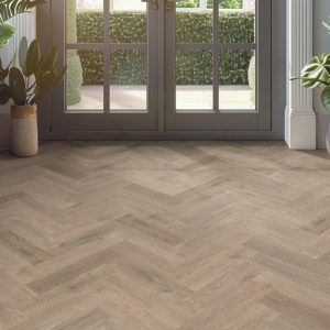 european oak effect herringbone LVT flooring laid in a living room
