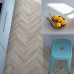 Pebble shore effect herringbone LVT flooring laid in a kitchen