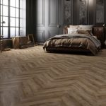 Smokey bay effect herringbone LVT flooring laid in a living room