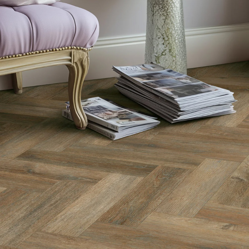 Urban dusk effect herringbone LVT flooring laid in a living room