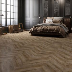 Smokey bay effect herringbone LVT flooring laid in a living room